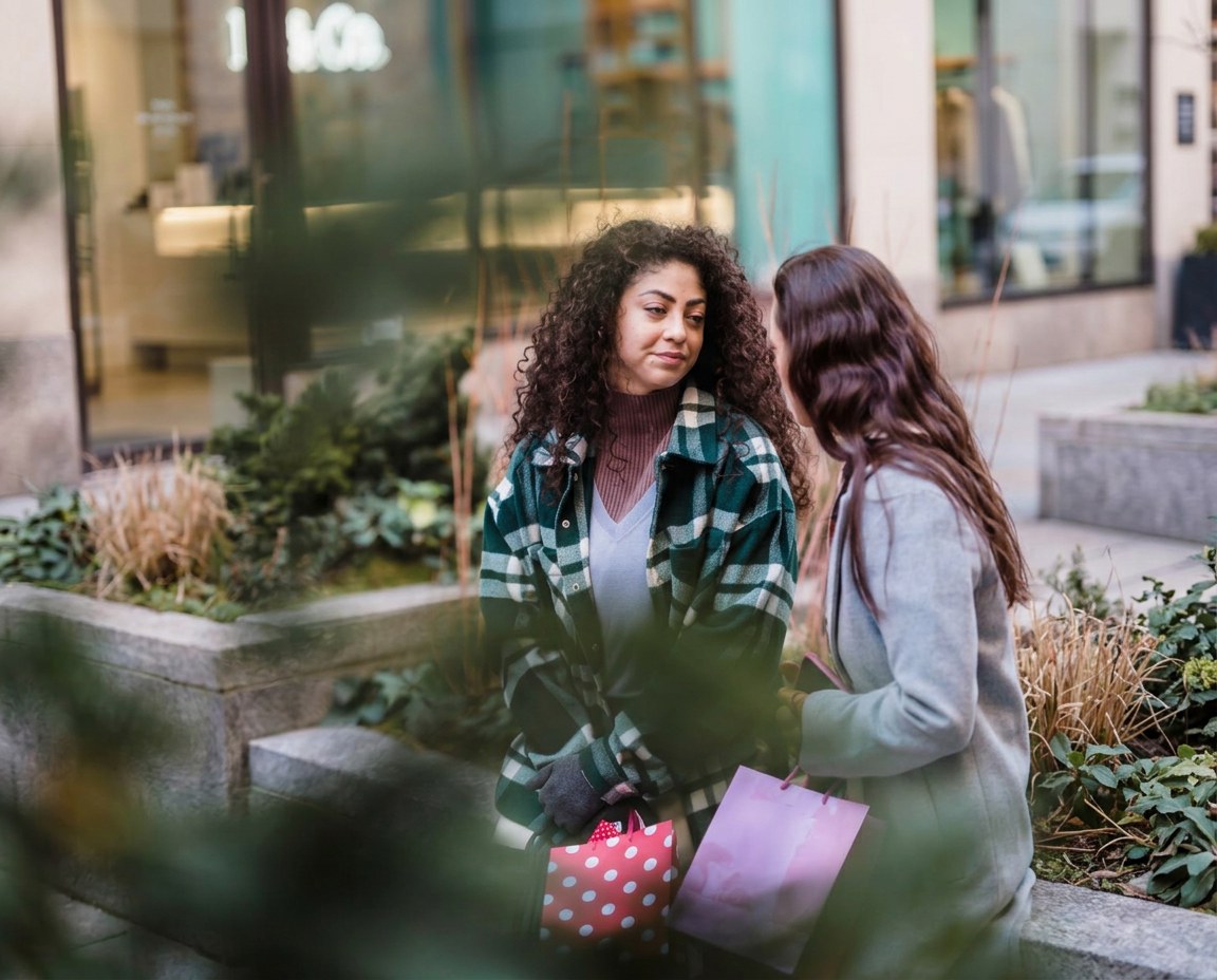 Friends shopping together outdoors
